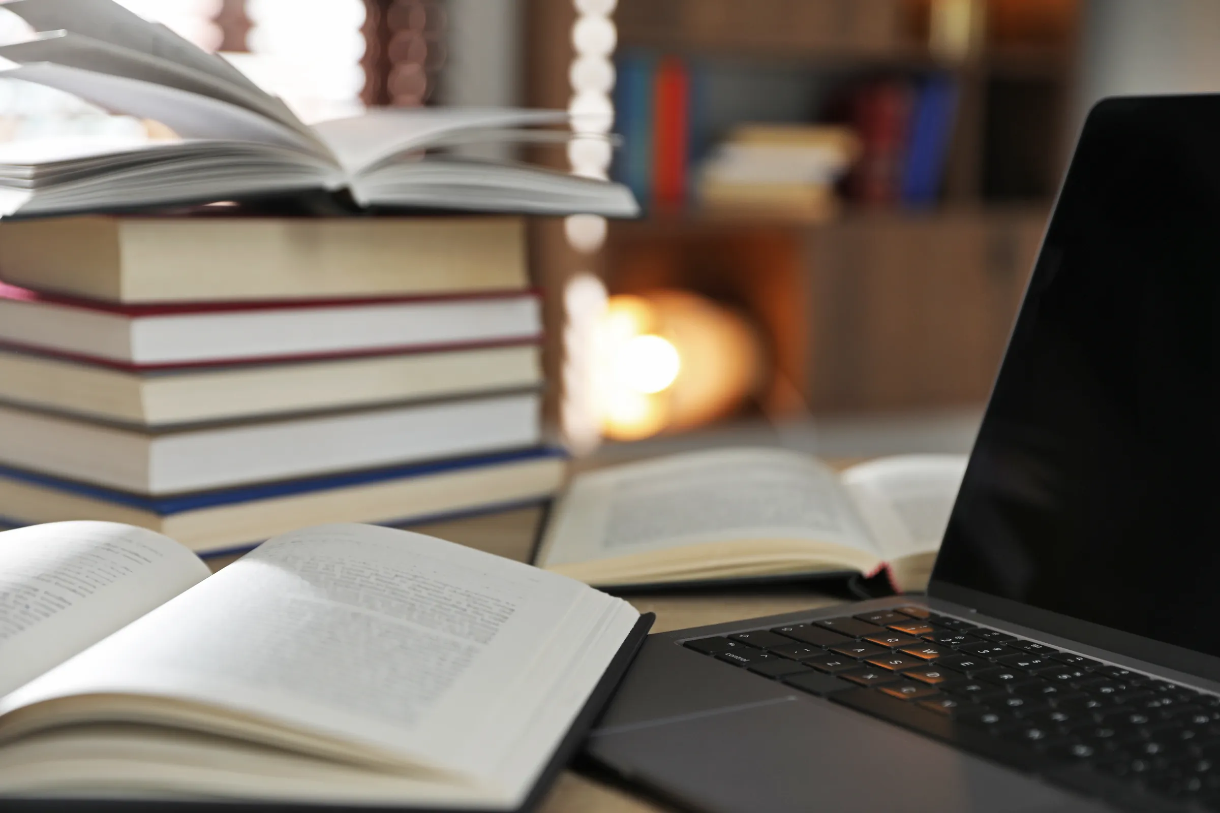 Books and a laptop on a study desk