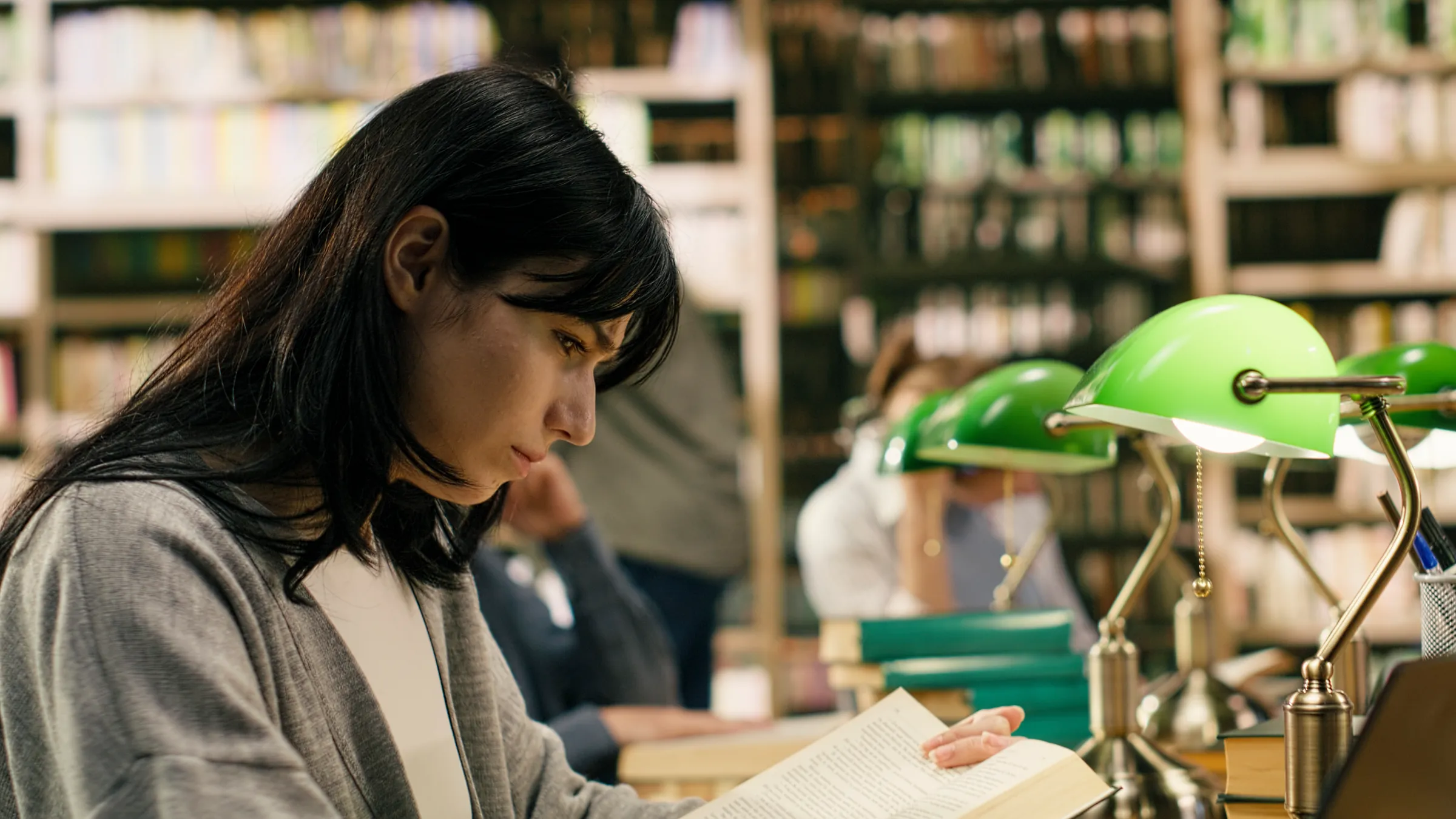 Student reading in a library