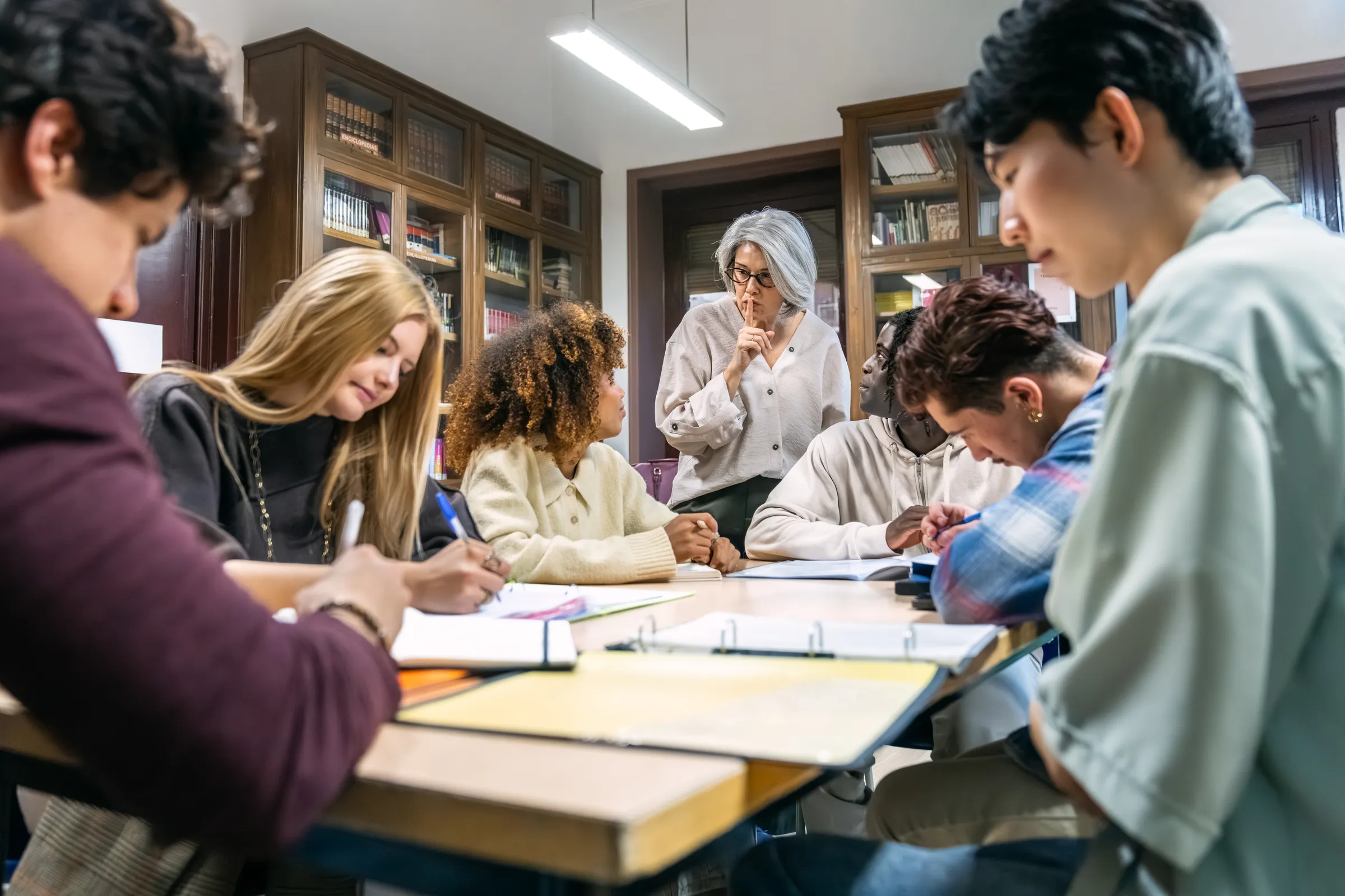 Students studying together in a library